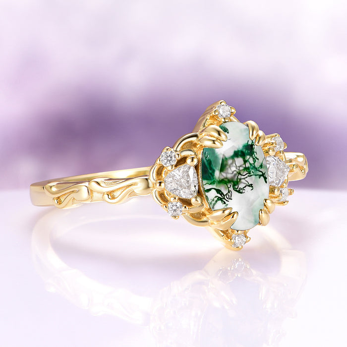 Esme Green Moss Agate Fairy Engagement Ring in 14K Solid Yellow Gold by Aquamarise Gold, featuring an oval moss agate with diamond accents and intricate gold fantasy-inspired detailing.