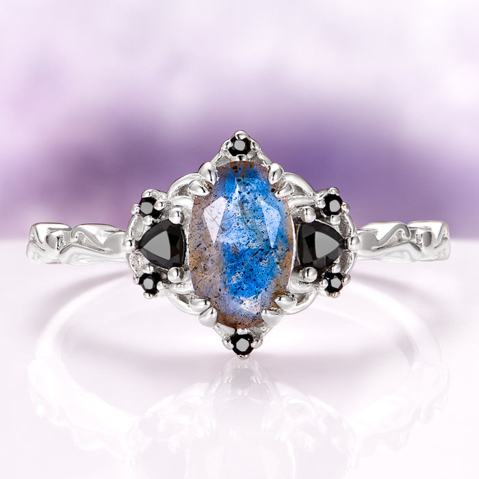 Esme Labradorite & Black Onyx Engagement Ring in 14K White Gold featuring a marquise-shaped labradorite center stone with surrounding black onyx accents on an intricately designed band by Aquamarise Gold, part of Solid Gold Engagement Rings and Non-Traditional Gemstone Engagement Rings collections.
