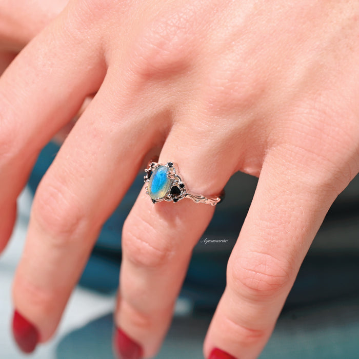 Esme Labradorite & Black Onyx Engagement Ring in 14K White Gold by Aquamarise Gold, featuring a luminous labradorite centerpiece with black onyx accents on a delicately detailed band, part of their non-traditional and nature-inspired engagement ring collections.