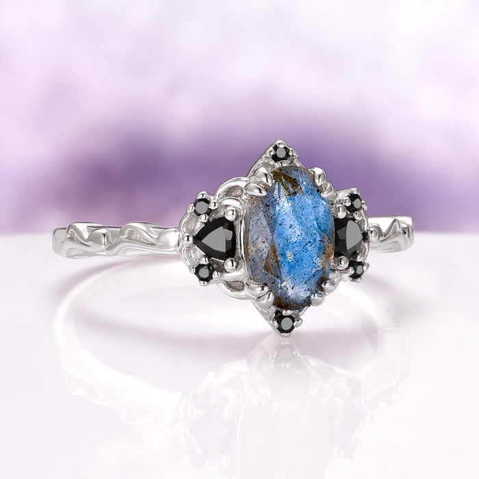 Esme Labradorite & Black Onyx Engagement Ring in 14K White Gold by Aquamarise Gold, featuring a unique oval labradorite center stone with black onyx accents on an intricately textured white gold band, part of nature-inspired and non-traditional gemstone engagement ring collections.