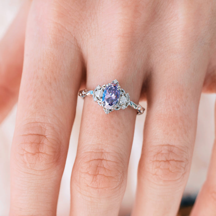 Esme Lavender Moissanite Ring Engagement Ring in 14K White Gold by Aquamarise Gold, featuring a glowing oval lavender moissanite center stone accented with delicate colorless moissanites on an intricately detailed white gold band, from the Solid Gold Engagement Rings and Nature-Inspired collections.