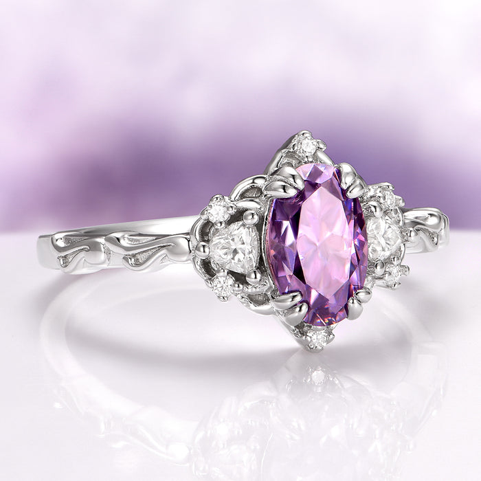 Esme Lavender Moissanite Ring Engagement Ring in 14K White Gold by Aquamarise Gold featuring a radiant oval lavender moissanite center stone accented with sparkling colorless moissanites on an intricately sculpted white gold band, part of Solid Gold Engagement Rings, Moissanite Engagement Rings, and Nature-Inspired collections.