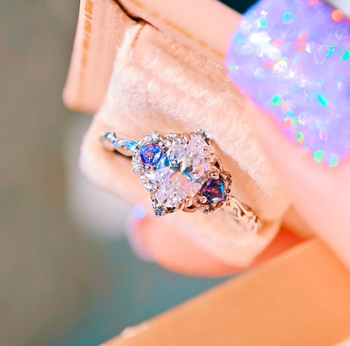 Esme Lab-Grown Diamond & Alexandrite Ring- 14K White Gold (IGI Certified) by Aquamarise Gold features a heart-shaped lab-grown diamond center flanked by vibrant alexandrite stones on an intricately detailed white gold band, part of Solid Gold Engagement Rings and April and June Birthstone Jewelry collections.