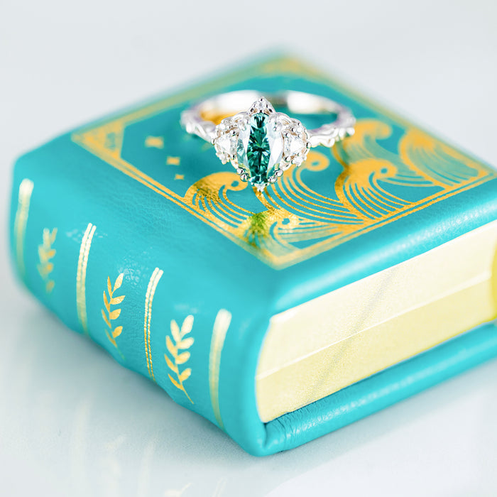 Summer Court Handmade Leather Book Ring Box- Ocean Tide Teal Edition (Small) by Aquamarise, a teal leather keepsake box with gold detailing for rings and meaningful jewelry gifts.
