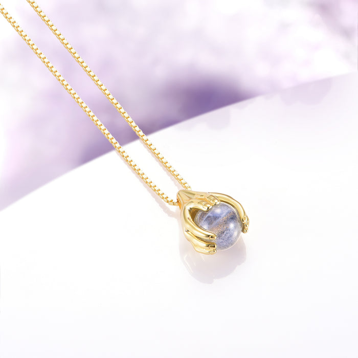 Ethereal Hold Labradorite Pendant Necklace in 14K Yellow Gold Vermeil by Aquamarise, featuring sculpted gold hands gently embracing a luminous natural labradorite gemstone on a fine yellow gold vermeil chain, part of Necklaces, Gold Vermeil Jewelry, Birthstone Jewelry, and Meaningful Jewelry Gifts collections.