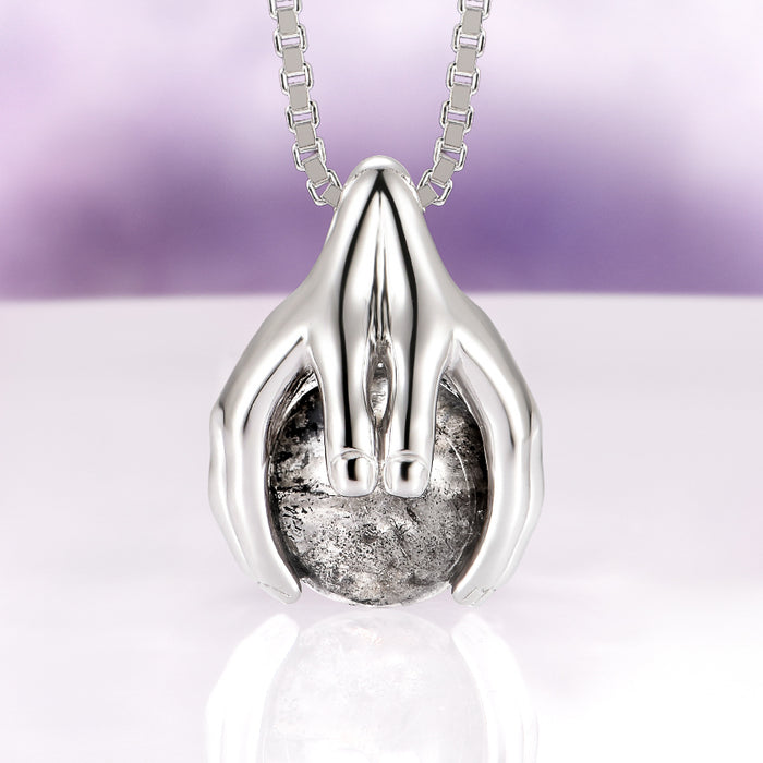 Ethereal Hold Natural Herkimer Diamond Pendant Necklace in Sterling Silver by Aquamarise, featuring sculpted silver hands gently cradling a natural Herkimer diamond on a sterling silver chain, part of Necklace and Birthstone Jewelry collections.