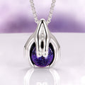 Ethereal Hold Starry Night Pendant Necklace in Sterling Silver by Aquamarise, featuring polished sterling silver sculpted hands gently cradling a luminous deep blue starry orb, part of Night Court Jewelry and Meaningful Gifts collections.