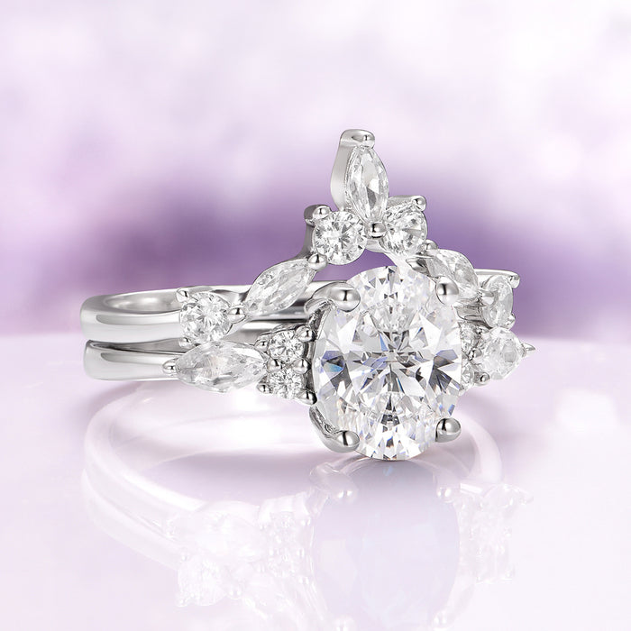 Evelyn Oval Cut White Sapphire Engagement Ring in Sterling Silver by Aquamarise, featuring a radiant oval-cut lab-grown white sapphire centerpiece with an intricate arrangement of marquise and round accent stones, part of Sterling Silver Rings and Alternative Engagement Rings collections.