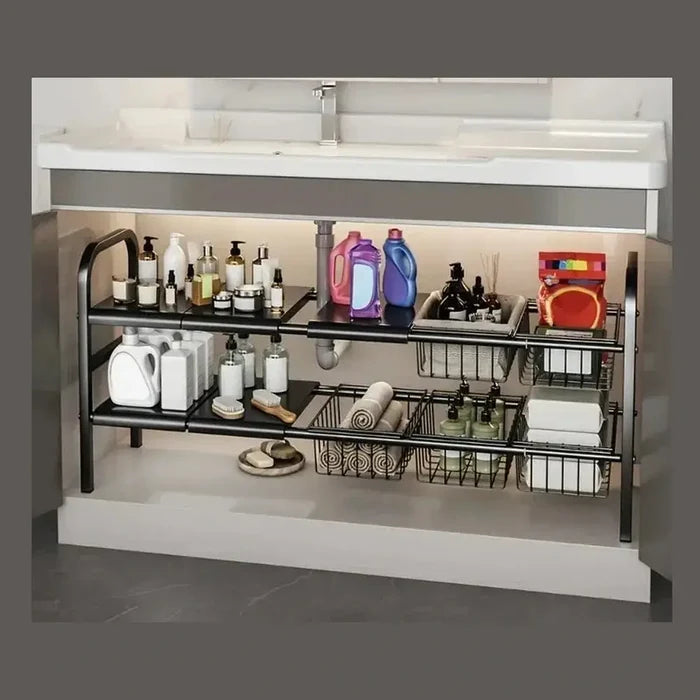 Expandable under sink shelf organizer with multiple tiers for kitchen and bathroom storage, neatly arranged with various products.