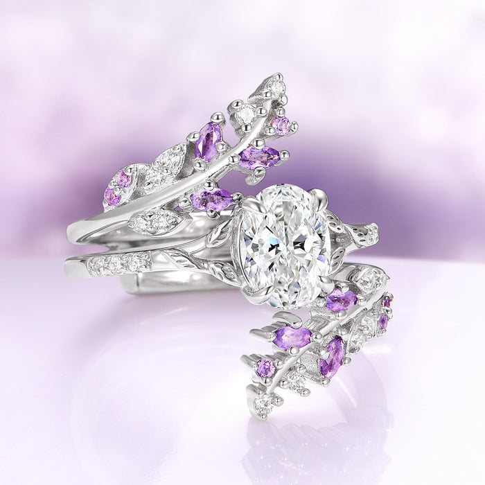 Oval Cut Lab-Grown Diamond & Amethyst Leaf Engagement Ring Set in 14K White Gold (IGI Certified) beautifully showcases an oval lab-grown diamond surrounded by delicate amethyst and diamond leaves, crafted by Aquamarise Gold from their nature-inspired and birthstone collections.