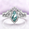 Fairy Green Moss Agate Leaf Ring Set in Sterling Silver by Aquamarise, featuring a marquise-cut green moss agate in a leaf-detailed setting with a matching crown band.