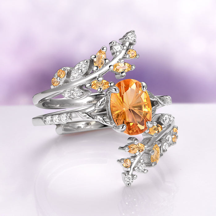 Fantasy Cut Citrine Couples Ring Set by Aquamarise, featuring intertwined silver bands with an oval citrine centerpiece surrounded by delicate branches accented with small citrine and white gemstones, part of Matching Couples' Rings and Fantasy-Inspired Jewelry collections.