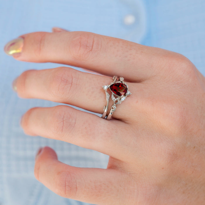 Fireworks Cut Lab-Grown Ruby Engagement Ring Set in 14K White Gold (Two Piece) by Aquamarise Gold, featuring a teardrop-shaped lab-grown ruby with nature-inspired leaf motifs on intertwined white gold bands, part of Solid Gold Engagement Rings, July Birthstone Jewelry, and Fantasy-Inspired Engagement Rings collections.