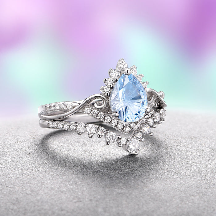 Faye Aquamarine Ring Set- Sterling Silver (Fantasy Cut) with pear-shaped aquamarine center and sparkling accents from Aquamarise, part of Sterling Silver Rings and Fantasy-Inspired Engagement Rings collections.
