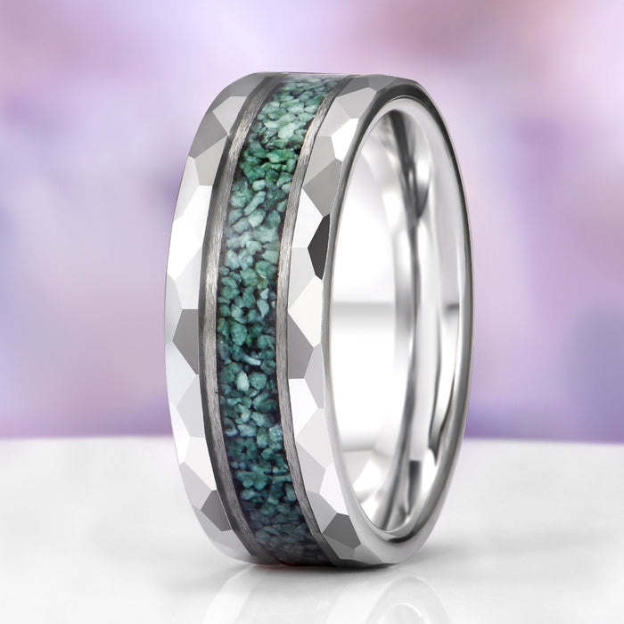 Silver ring with greenstone inlay on a gradient background