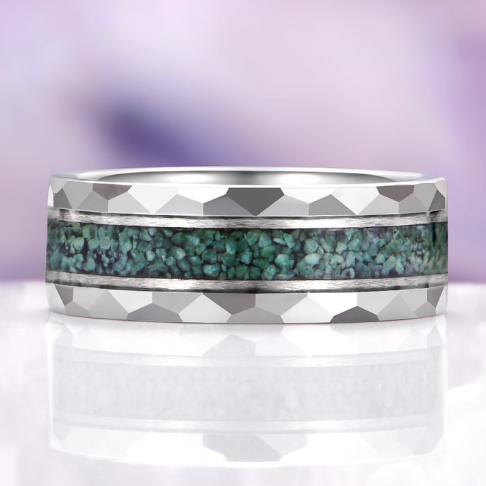 Silver ring with turquoise inlay on a white and purple gradient background
