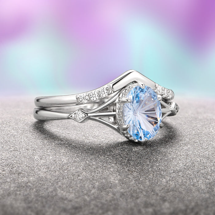 Fireworks Cut Aquamarine Couples Ring Set by Aquamarise featuring a brilliant aquamarine gemstone with a unique cut set in an elegant silver band accented with small diamonds, part of Matching Couples' Rings and March Birthstone Jewelry collections.