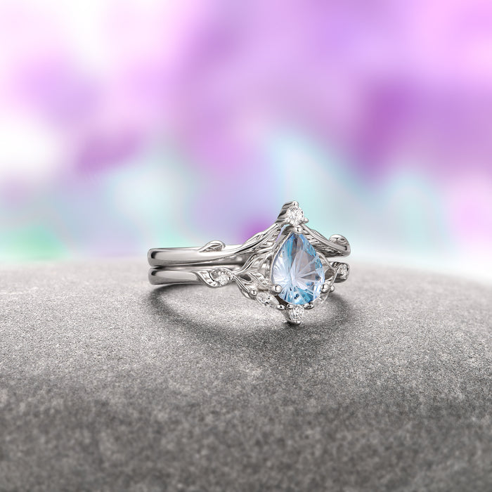 Fireworks Cut Aquamarine Engagement Ring Set in 14K White Gold (Fantasy Cut) by Aquamarise Gold, showcasing a delicate pear-shaped aquamarine with intricate vine-inspired white gold bands, part of Solid Gold Engagement Rings and March Birthstone Jewelry collections.