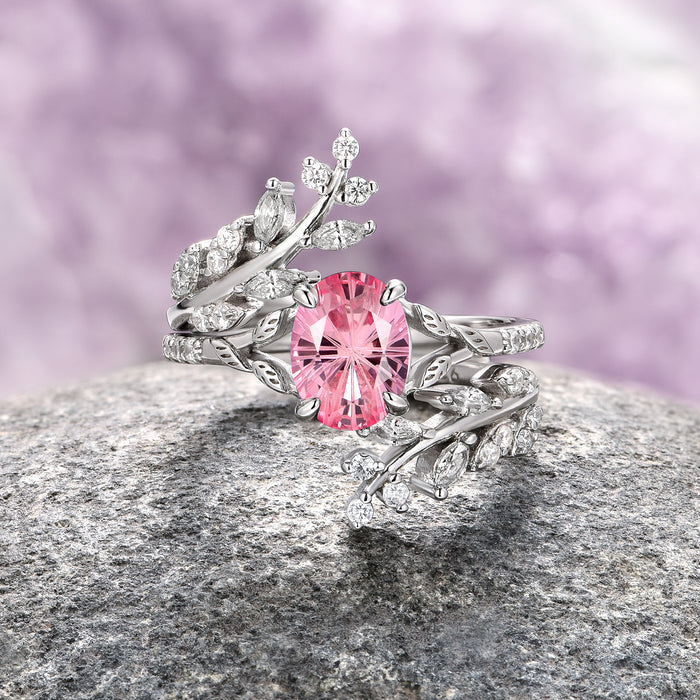 Fireworks Cut Lab-Grown Pink Sapphire Leaf Engagement Ring Set in Sterling Silver by Aquamarise featuring an oval pink sapphire centerpiece surrounded by intricately detailed sterling silver leaves with sparkling diamond accents, part of Sterling Silver Rings, September Birthstone Jewelry, and Nature-Inspired Engagement Rings collections.