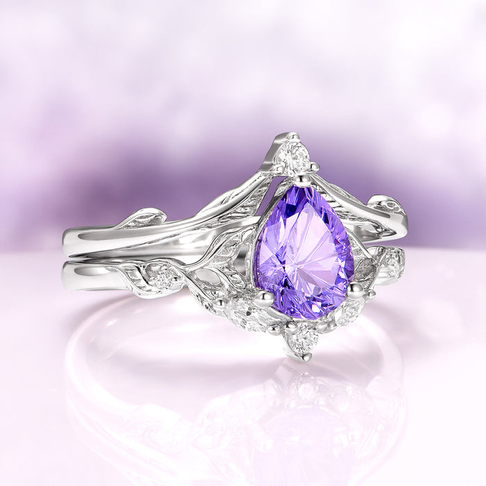 Fireworks Cut Lab-Grown Lavender Sapphire Engagement Ring Set in 14K White Gold featuring a pear-shaped star-cut lavender sapphire centerpiece with intricate vine-inspired white gold detailing and delicate diamond accents by Aquamarise Gold, part of Solid Gold Engagement Rings and Nature-Inspired Engagement Rings collections.