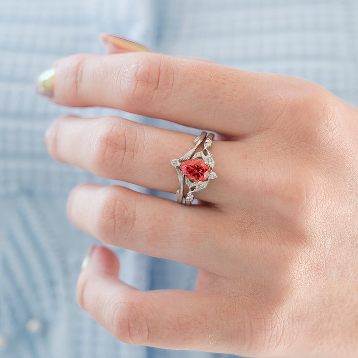 Fireworks Cut Padparadscha Sapphire Engagement Ring Set in 14K White Gold featuring a unique fiery padparadscha sapphire with delicate leaf-inspired white gold band and diamond accents by Aquamarise Gold, part of Solid Gold Engagement Rings and September Birthstone Jewelry collections.