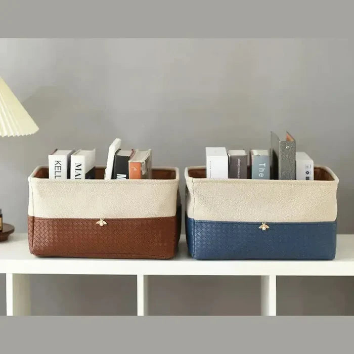 Foldable storage basket organizer in brown and blue with books.
