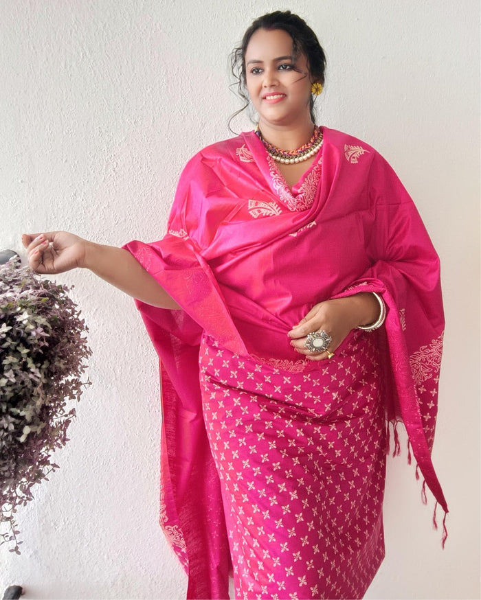 Vivid fuchsia pink katan silk unstitched suit set with a large hand block printed feather-like botanical motif on the dupatta