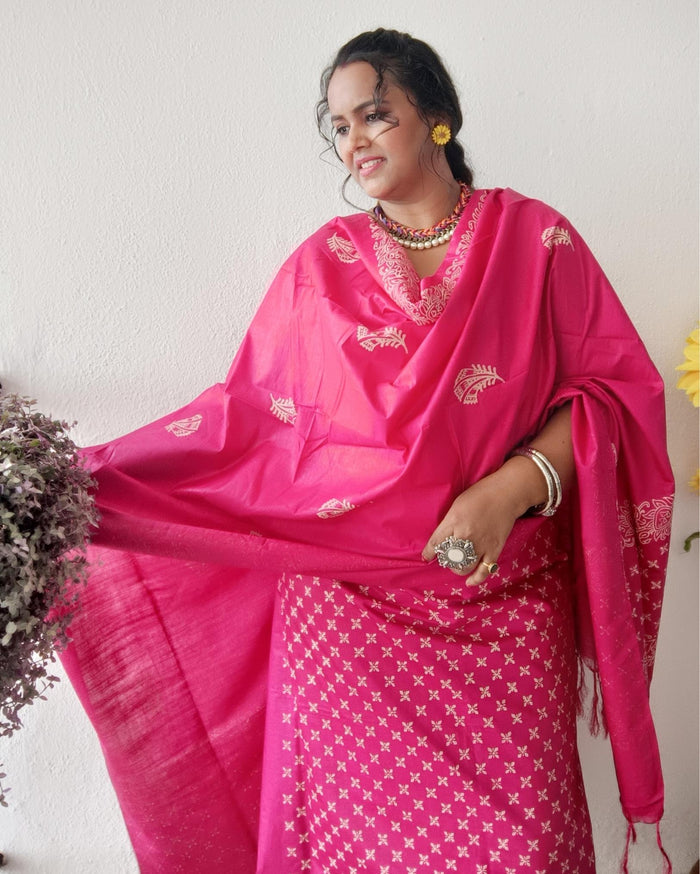 Vivid fuchsia pink katan silk unstitched suit set with a large hand block printed feather-like botanical motif on the dupatta