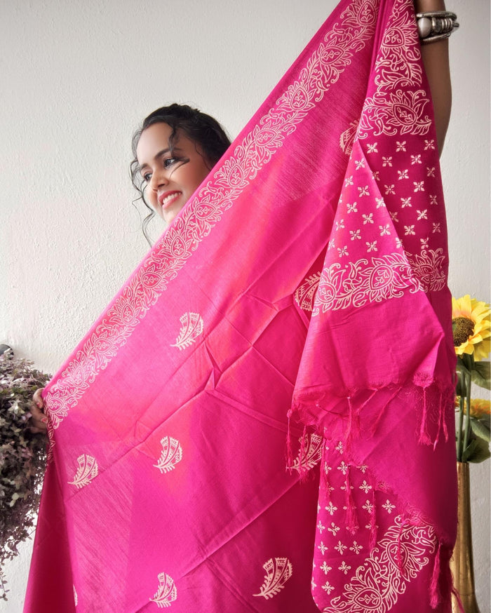 Vivid fuchsia pink katan silk unstitched suit set with a large hand block printed feather-like botanical motif on the dupatta