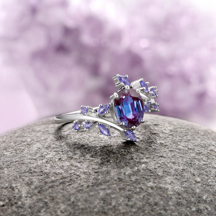 Galaxy Alexandrite Leaf Couples Ring Set featuring a central oval-cut alexandrite with shifting purples and blues, accented by delicate leaf-inspired violet stones on a polished silver band by Aquamarise, part of Matching Couples' Rings and June Birthstone Jewelry collections.