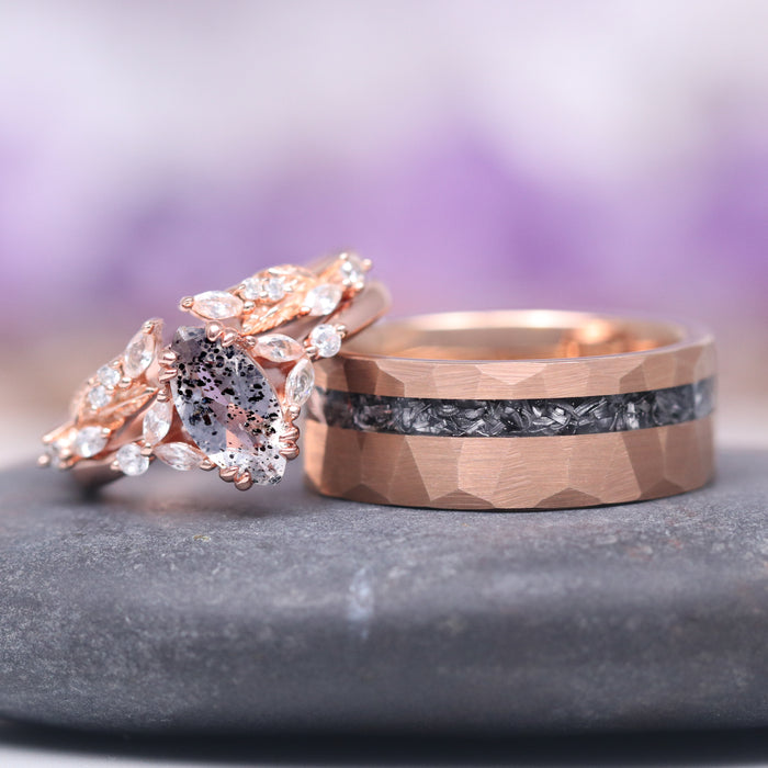 Galaxy Salt and Pepper (Herkimer) Diamond & Meteorite Couples Ring Set featuring a rose gold band with a textured meteorite inlay and a complementary ring adorned with a salt and pepper Herkimer diamond surrounded by delicate leaf-shaped accents, crafted by Aquamarise.