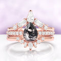 Galaxy Raw Salt & Pepper (Herkimer) Diamond Ring Set- 14K Rose Gold Vermeil by Aquamarise, featuring a pear-shaped salt and pepper diamond with white diamond accents on rose gold bands.