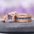 Galaxy Salt and Pepper (Herkimer) Diamond & Meteorite Couples Ring Set featuring a rose gold band with a textured meteorite inlay and a complementary ring adorned with a salt and pepper Herkimer diamond surrounded by delicate leaf-shaped accents, crafted by Aquamarise.