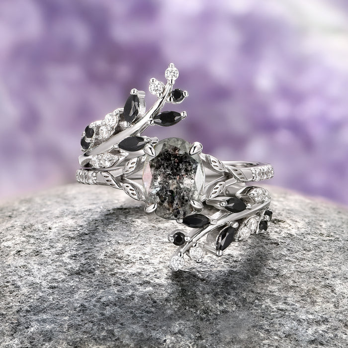 Black Moissanite Leaf Ring Guard in 14K White Gold by Aquamarise Gold, featuring intricate vine and leaf designs accented with black and white moissanite stones, part of Solid Gold Engagement Rings and Lovers of the Dark™ collections.