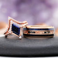 Galaxy Sandstone Couples Ring Set by Aquamarise, featuring a star-shaped rose gold ring with blue sandstone and diamonds, paired with a wide band with blue and copper inlays.