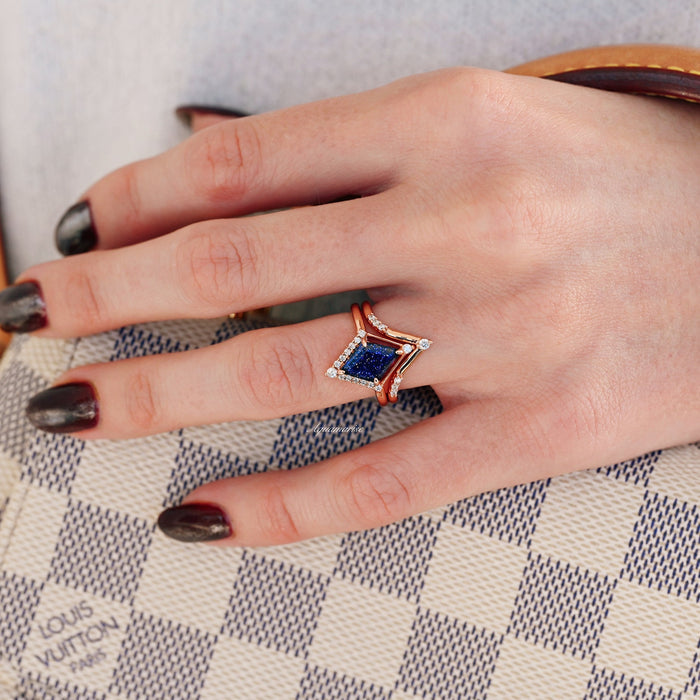 Galaxy Sandstone Couples Ring Set by Aquamarise, featuring rose gold bands with a deep blue sandstone center stone and delicate accent diamonds from Matching Couples' Rings collection.