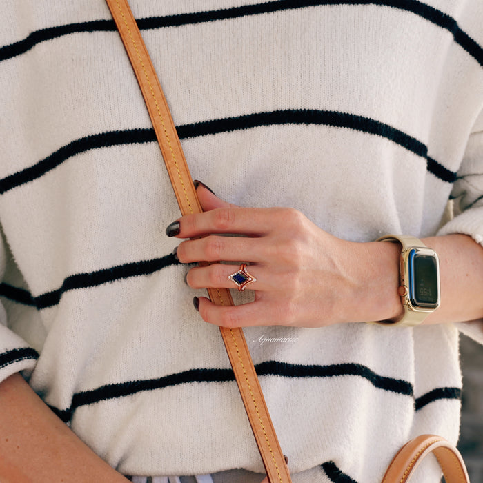 Starry Night Couples Ring Set by Aquamarise featuring a celestial-themed blue sandstone and rose gold ring worn on hand, styled with casual striped sweater and tan leather bag strap.