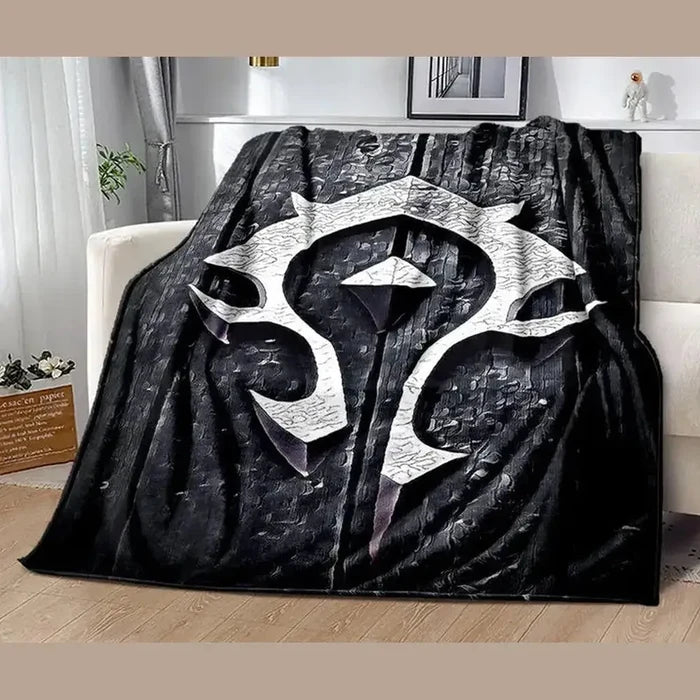 Gamer plush throw blanket featuring a bold emblem design on textured fabric, ideal for cozy gaming sessions.