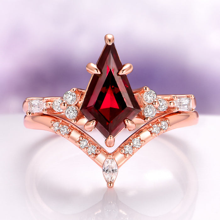 Garnet & Red Fire Opal Whiskey Barrel Couples Ring Set by Aquamarise featuring a striking kite-cut garnet with marquise and round diamond accents in a rose gold setting.