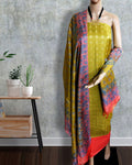 Gold yellow Katan silk unstitched suit set with a small geometric printed tunic, a multicolour paisley and diagonal striped dupatta, and solid red bands at both hems