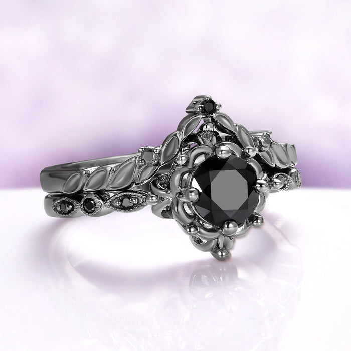 Gothic Vintage Floral Ring Set in Black Ruthenium by Aquamarise, featuring a black gemstone with floral and leaf motifs on a dark ruthenium band, from Lovers of the Dark™ collection.