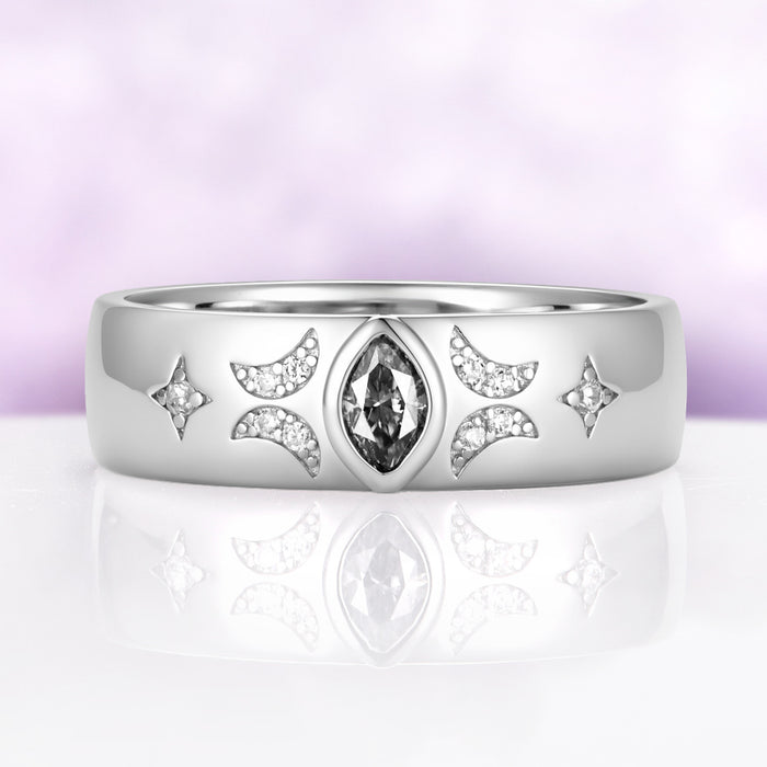 Close view of the gray moissanite celestial band showing the milgrain-edged crescents, star accents and polished dome profile