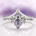 Gray Moissanite Crescent Moon Couples Ring Set by Aquamarise featuring a marquise-cut gray moissanite center stone accented by crescent moon motifs and small diamonds on polished silver bands, from Matching Couples' Rings and Moissanite Gemstone Jewelry collections.