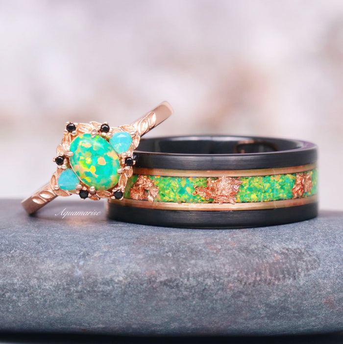 Green Fire Opal Leaf Engagement Ring in 14K Rose Gold Vermeil featuring a vivid green opal center with black gemstones beside a contrasting black and rose gold band inlaid with green opal and rose accents.