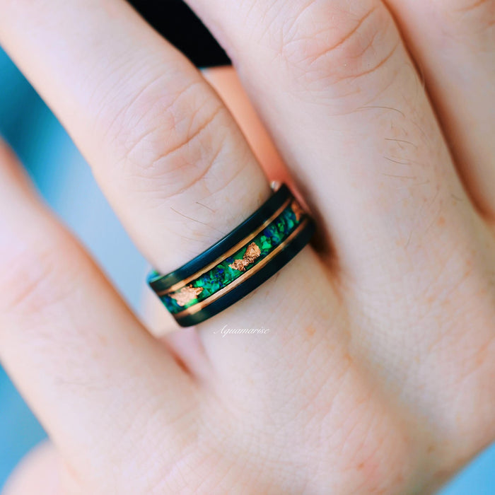 Green Fire Opal & Moss Agate Leaf Couples Ring Set by Aquamarise featuring a black band with vibrant green fire opal and moss agate inlay accented by copper leaf details symbolizing love.