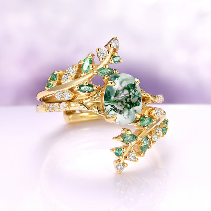 Green Moss Agate & Emerald Leaf Engagement Ring Set in 14K Solid Yellow Gold by Aquamarise Gold, featuring a unique moss agate centerpiece surrounded by delicate emerald and diamond accents in an intricate nature-inspired design.