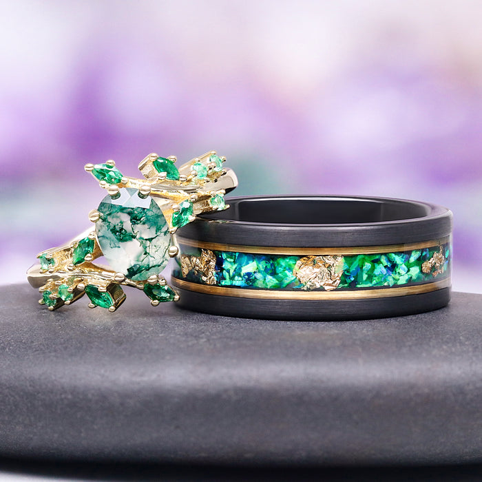 Green Moss Agate & Fire Opal & Gold Leaf Couples Ring Set by Aquamarise features a nature-inspired design with vibrant green moss agate, sparkling fire opal, and gold leaf accents on contrasting black and gold bands, part of Matching Couples' Rings and October Birthstone collections.