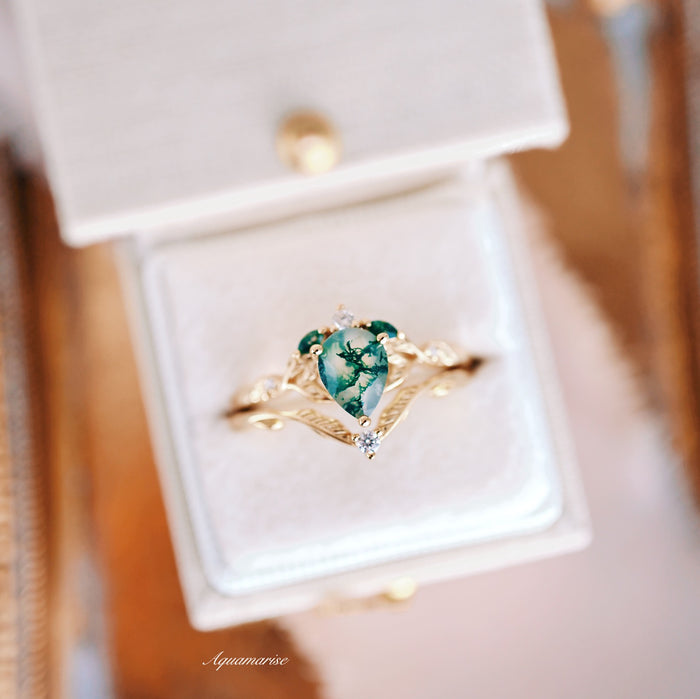 Green Moss Agate Leaf Engagement Ring Set in 14K Solid Yellow Gold featuring a pear-shaped green moss agate with detailed feather-like gold accents and a small diamond, by Aquamarise Gold from collections including Solid Gold Engagement Rings and Nature-Inspired Engagement Rings.