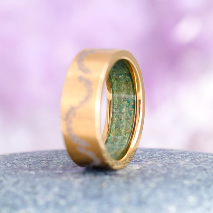 Green Moss Agate Leaf Wedding Band in Yellow Gold Titanium (8mm) by Aquamarise, featuring a brushed gold titanium exterior with engraved leaf detail and a green moss agate inlay, part of Men's Wedding Bands and Moss Agate Jewelry collections.