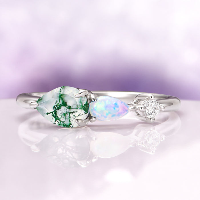 Green Moss Agate & Natural Australian Fire Opal Ring in Sterling Silver by Aquamarise featuring pear-shaped green moss agate, natural Australian white fire opal, and CZ accent on delicate band.